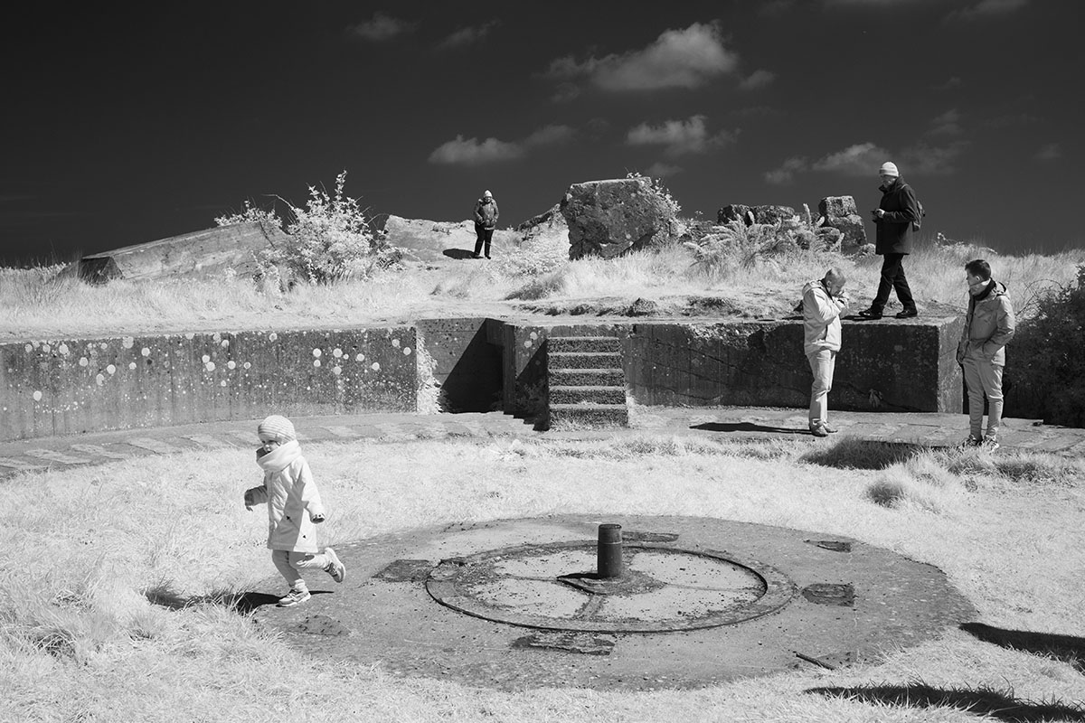 Infrared Photo of Child Running in WWII Concrete Gun Emplacement